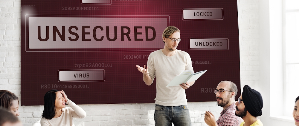 Business team discussing cybersecurity strategy in office